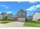Charming two-story home with well-maintained lawn and attached two-car garage nestled in a friendly neighborhood at 525 Willow Breeze Ct, Zebulon, NC 27597