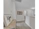 Bright upstairs hallway with carpet, decor and open access to rooms at 525 Willow Breeze Ct, Zebulon, NC 27597