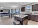 The spacious kitchen flows seamlessly into the dining and living areas, featuring an island and stainless steel appliances at 525 Willow Breeze Ct, Zebulon, NC 27597
