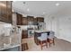 Well-equipped kitchen boasts granite countertops, stainless steel appliances, and a convenient center island with bar seating at 525 Willow Breeze Ct, Zebulon, NC 27597