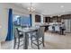 Open kitchen and dining area with modern appliances and abundant natural light from the adjacent sliding glass door at 525 Willow Breeze Ct, Zebulon, NC 27597