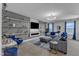 Stylish living room with a modern fireplace, floating shelves, and comfortable seating for relaxation and entertainment at 525 Willow Breeze Ct, Zebulon, NC 27597