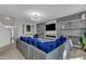 Well-lit living room with modern accents, comfortable seating, and an inviting atmosphere for gatherings and relaxation at 525 Willow Breeze Ct, Zebulon, NC 27597
