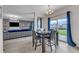 Open concept living room and dining area featuring stylish decor and plenty of natural light at 525 Willow Breeze Ct, Zebulon, NC 27597