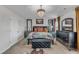 Elegant main bedroom features a luxurious bed, decorative mirrors, and ample closet space, creating a relaxing retreat at 525 Willow Breeze Ct, Zebulon, NC 27597