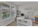 Bright home office featuring a large window, a white desk, and ample shelving for a productive workspace at 525 Willow Breeze Ct, Zebulon, NC 27597