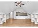 Bright attic features hardwood floors, kitchenette, and lots of shelf space at 5309 Overtop Ln, Raleigh, NC 27613