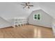 Bright attic features hardwood floors, window, and lots of shelf space at 5309 Overtop Ln, Raleigh, NC 27613