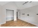 Attic with hardwood floors features a built in desk and open closet space at 5309 Overtop Ln, Raleigh, NC 27613