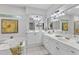 Bright bathroom with double vanity, soaking tub, and stylish decor at 5309 Overtop Ln, Raleigh, NC 27613