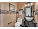 Elegant powder room features decorative wallpaper, a vessel sink, and stylish lighting fixtures at 5309 Overtop Ln, Raleigh, NC 27613