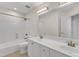 Bathroom features a double vanity and shower with tub combination at 5309 Overtop Ln, Raleigh, NC 27613