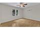 Bedroom with ceiling fan and a single window view to the trees outside at 5309 Overtop Ln, Raleigh, NC 27613
