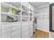 Organized walk-in closet with shelves, drawers, and ample storage space at 5309 Overtop Ln, Raleigh, NC 27613