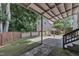 Covered patio area with artificial grass, connecting to the main house and offering outdoor living space at 5309 Overtop Ln, Raleigh, NC 27613