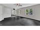Exercise room with large mirrors features two large windows and dark floors at 5309 Overtop Ln, Raleigh, NC 27613