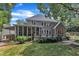 Exterior view of home featuring a screened-in porch and deck, with ample space for outdoor entertaining at 5309 Overtop Ln, Raleigh, NC 27613