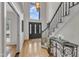 Grand foyer with hardwood floors and a soaring window, creating a bright and welcoming entry at 5309 Overtop Ln, Raleigh, NC 27613
