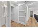 Second floor hallway features a sliding door and hardwood floors at 5309 Overtop Ln, Raleigh, NC 27613