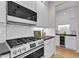 A stylish kitchen features sleek cabinets, stainless steel appliances, and a modern backsplash at 5309 Overtop Ln, Raleigh, NC 27613