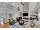 Bright, open floor plan living area includes a fireplace and hardwood floors at 5309 Overtop Ln, Raleigh, NC 27613