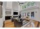 Spacious living room boasts a decorative fireplace with a large TV, and recessed lighting at 5309 Overtop Ln, Raleigh, NC 27613