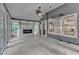 Inviting sunroom showcases tile flooring, a fireplace, and large windows for natural light at 5309 Overtop Ln, Raleigh, NC 27613