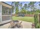 Inviting backyard with outdoor seating and a modern shed with glass doors at 554 Beacon Ridge Blvd, Chapel Hill, NC 27516