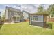 View of the backyard features a contemporary shed and a patio with outdoor seating at 554 Beacon Ridge Blvd, Chapel Hill, NC 27516