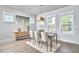 Cozy dining room with modern decor, dining table, and large windows offering backyard views and natural light at 554 Beacon Ridge Blvd, Chapel Hill, NC 27516