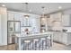 Modern kitchen with stainless steel appliances, granite countertops, a center island and stylish pendant lighting at 554 Beacon Ridge Blvd, Chapel Hill, NC 27516