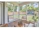Relaxing screened porch with wood floors and backyard views at 554 Beacon Ridge Blvd, Chapel Hill, NC 27516