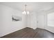 Dining room featuring a modern chandelier, closet, and natural light at 600 Audubon Lake Dr # 4B11, Durham, NC 27713