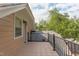Cozy balcony overlooking neighborhood with iron railing and tile flooring at 601 E Franklin St, Raleigh, NC 27604