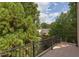 Cozy balcony overlooking neighborhood with iron railing and tile flooring at 601 E Franklin St, Raleigh, NC 27604