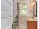 Bathroom with natural light, mosaic tile accent and updated vanity at 601 E Franklin St, Raleigh, NC 27604
