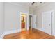 Large bedroom next to bathroom, lots of doors, hardwood floors and nice trim at 601 E Franklin St, Raleigh, NC 27604