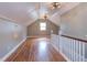 Spacious bonus room features beautiful hardwood floors, natural light, and access to storage at 601 E Franklin St, Raleigh, NC 27604