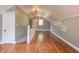 Spacious bonus room features beautiful hardwood floors, natural light, and access to storage at 601 E Franklin St, Raleigh, NC 27604