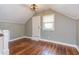Spacious bonus room features beautiful hardwood floors, natural light, and access to storage at 601 E Franklin St, Raleigh, NC 27604