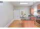 Kitchen with an island, stainless steel appliances and butcher block counters at 601 E Franklin St, Raleigh, NC 27604