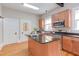 Kitchen with an island, stainless steel appliances, beautiful cabinets and butcher block counters at 601 E Franklin St, Raleigh, NC 27604