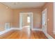 Spacious living room featuring hardwood floors and an open doorway to another room at 601 E Franklin St, Raleigh, NC 27604