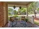Cozy porch with comfortable seating, hanging plants, and a charming view of the neighborhood at 601 E Franklin St, Raleigh, NC 27604