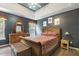 A bedroom featuring a striking navy blue color scheme, complemented by wooden furniture and moon-themed wall decor at 601 Texanna Way, Holly Springs, NC 27540