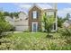 Charming two-story home with brick and siding, a well-manicured lawn, and mature trees at 601 Texanna Way, Holly Springs, NC 27540