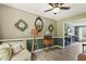 Inviting living room with a comfortable couch, a ceiling fan, and views into the adjacent room at 601 Texanna Way, Holly Springs, NC 27540