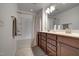 Bathroom features a double sink vanity, shower-tub combination, and neutral decor at 6027 Kentworth Drive. Dr, Holly Springs, NC 27540