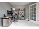 Cozy bedroom featuring a desk, open shelving, and a comfortable chair, perfect for work or relaxation at 6027 Kentworth Drive. Dr, Holly Springs, NC 27540