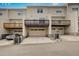 Townhome exterior with driveways, attached garages, and a wooden patio at 6027 Kentworth Drive. Dr, Holly Springs, NC 27540
